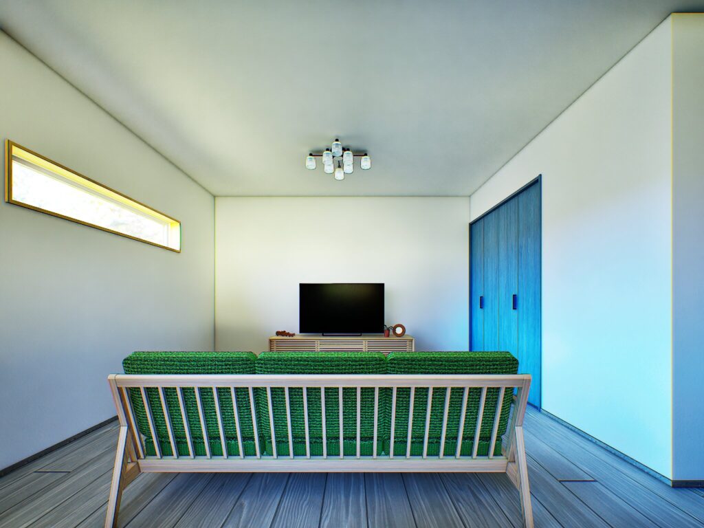 木の質感を活かしたソファの背面デザインが、空間の間仕切りとして美しく機能しています。